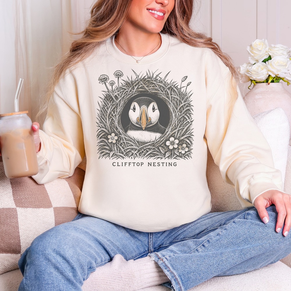 Clifftop Nesting Puffin Peering from Its Burrow Sweatshirt